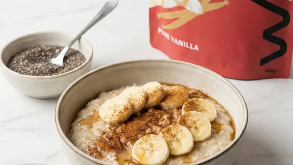 Bowl of steaming porridge next to a protein powder container – heating protein powder does not destroy its nutritional value